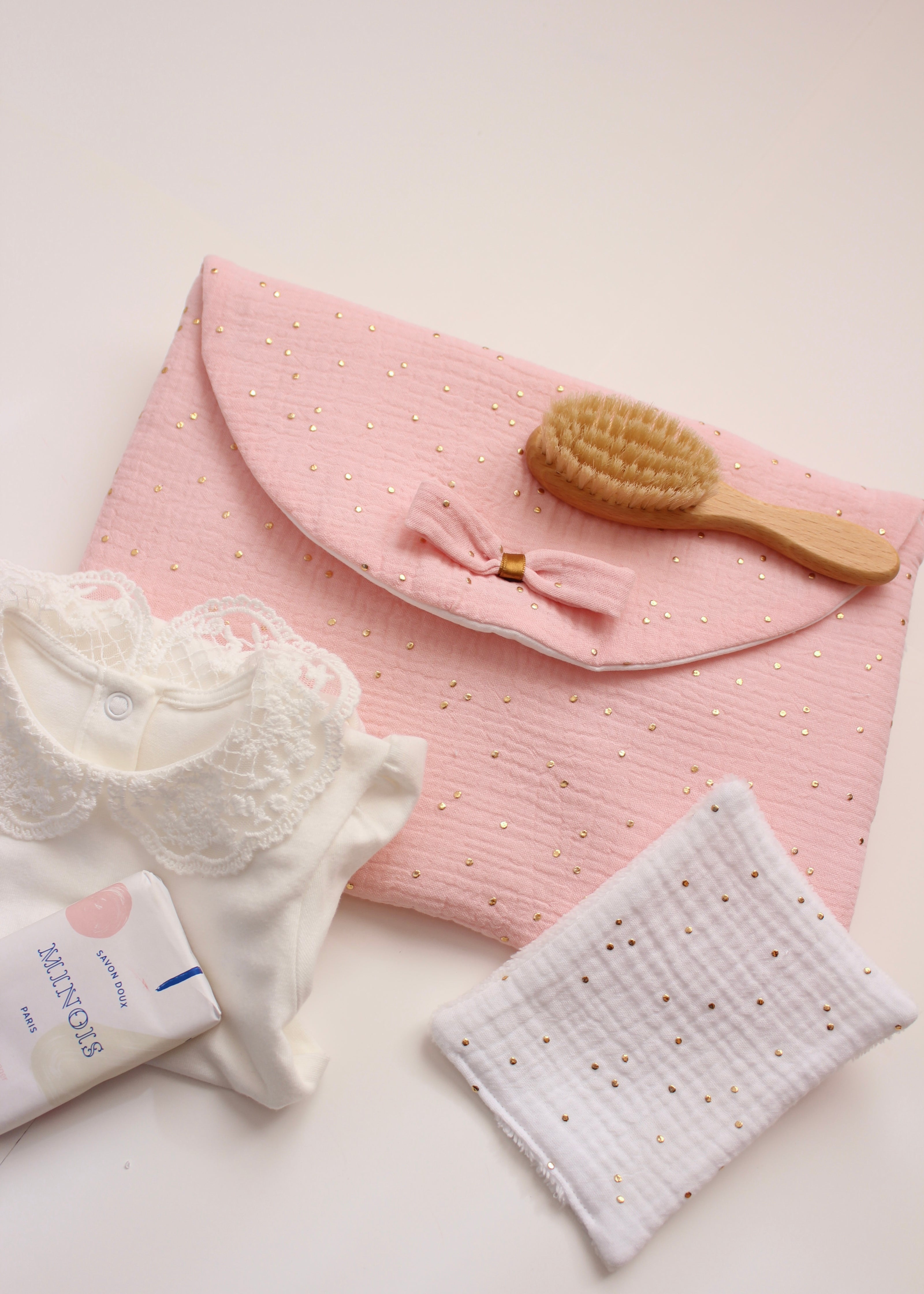 Pochette à couches rose doré